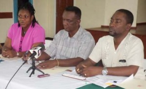  GTU Administrative Field Officer, Lancelot Baptiste, is flanked by GTU’s General Secretary, Coretta McDonald (left) and GTU President Mark Lyte. 