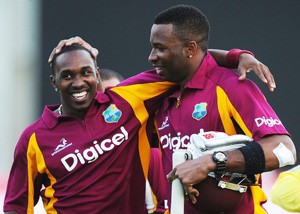 West Indies cricketers Dwayne Bravo (L) and Kieron Pollard celebrate their victory during the second-of-five One Day International (ODI) matches between West Indies and Australia at the Arnos Vale Ground in Kingstown on March 18, 2012. West Indies defeated Australia by 5 wickets to level the series 1-1. AFP PHOTO/Jewel Samad (Photo credit should read JEWEL SAMAD/AFP/Getty Images)