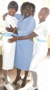 Sharing a light moment with two of her students recently 