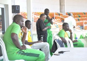 Coach Crandon (left) and members of his support staff, Rayon Griffith (2nd right) and Physio Paul Gomes (right) at Sabina Park in Jamaica.