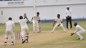 Floyd Reifer smashes Damion Jacobs for four before being dismissed by the leg spinner.