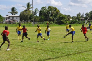 Action in the Grove High Tech (yellow & blue) vs. Diamond United game on the first day of competition, January 23.      