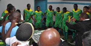 Head Coach Jamaal Shabazz giving final instructions to the Golden Jaguars moments before they took on Barbados on February 1, 2015.      