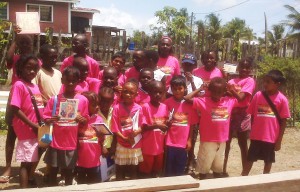 Dainty and a group of children at her library upon the completion of the Summer Reading Programme recently 