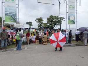 Students again blocked the entrance to the University of Guyana yesterday.