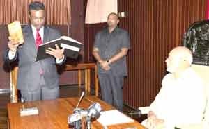 Sase Gunraj taking his oath as a GECOM Commissioner before President Donald Ramotar 