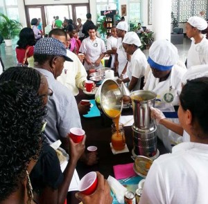 Carnegie School of Home Economics students demonstrating how to make healthy juices.