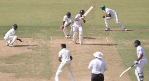 Kjorn Ottley gathers on side runs against Narsingh Deonarine during his 78-run stand with Yannick Cariah.