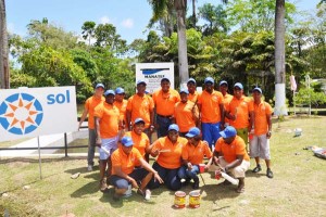  (Fifth from left back row) General Manager, (GM) of Sol Guyana, Orlando Boxhill with staff who participated in the painting project.