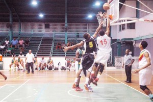 Colts’ guard, Shelroy Thomas (#15) goes up in heavy traffic for a floater off the glass Saturday night in the Semi-Finals.