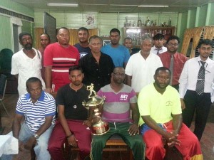  Sponsor Alvin Chowramootoo (holding trophy) with representatives from the clubs in West Berbice.