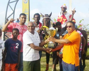 Connection of the Jumbo Jet Stable receives their trophy for Settling Jet’s victory in the G1 and lower race.