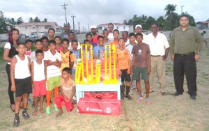 Children at the Farm Community Centre ground in the company of the President of EBDCA, Anand Kalladeen (1st from right) and Overseer of the Little Diamond/Herstelling NDC, Diane Barath.