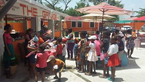 Some of the children receiving bird kites and a hot meal.