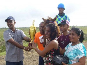 Mr. Ghansham Singh, at left, presents the winning trophy in the L1 race for Secretariat’s Victory.