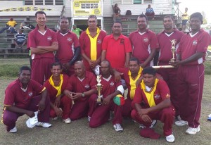 Members of the Enterprise Over-40 team pose with their trophies on Sunday. 