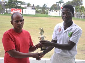 Sherfene Rutherford collects his man of the match prize from selector Nazimul Drepaul 