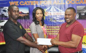 Star Party Rental’s Robert Joseph presents Petra Organisation Co-DirectorTroy Mendonca with the sponsorship cheque in the presence of fellow staffer Kesheke Washington yesterday.