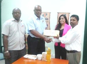 In Photo from left are Mr. Eric Whaul-Sales and Marketing Rep TCL; Mark Bender-Plant Manager TCL; Miss Jennifer Ganesh-Prevention Coordinator NAPS and Mr. Somdatt Ramessar-Senior Social Worker/Nutritionist NAPS.