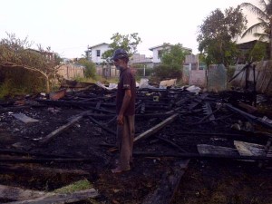  Kayum Bassalut surveys the area where his house once stood.