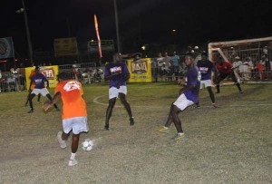 A player from Queen Street Tiger Bay unleashes a shot at the West Front Road goal during their encounter on Friday night at the GFC ground.