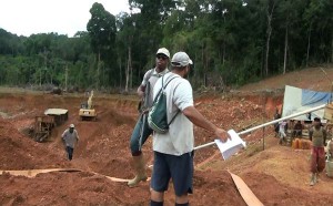  Mario Figuera armed with the injunction confronts one of the gunmen. 