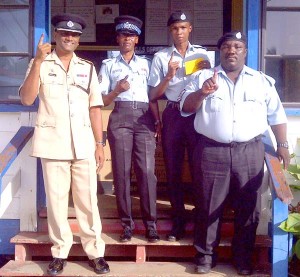 Ranks proudly display their inked fingers after casting their votes at the Cove and John Police Station.