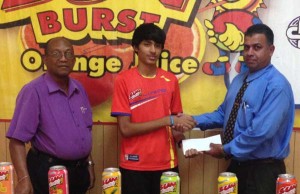 Narayan Ramdhani receives the cheque from this Continental Group of Companies Representative in the presence of Company Secretary, Percival Boyce Jr.