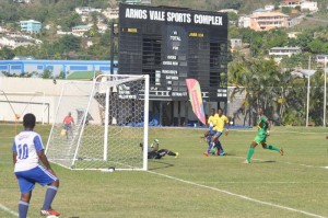 Brandon Beresford (on ground) drilled his shot past SBG’s GK Winslow McDowall for Guyana’s first goal.