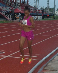 Cassey George crosses the finish line unrivalled in the 800m Girls’ Youth Final yesterday at the National Track and Field Centre. 