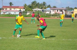 Neil Danns (left) controls the ball yesterday.