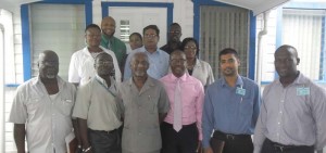 Minister Keith Scott (front, third left) along with senior GWI officials.