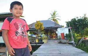 A child relaxing at the Guest House landing. 