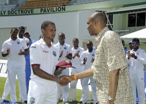 Shane Dowrich gets his Test cap from Norbert Phillip, West Indies v Australia, 1st Test, 1st day, Roseau, June 3, 2015 ©WICB Media/Randy Brooks of Brooks LaTouche Photo