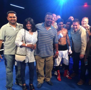 Elton Dharry pose for pictures after the fight with supporters and members of his team including Guyanese legend Lennox Blackmore (3rd left).