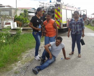   Youmanram Bissesar collapses after his house was flattened by fire.