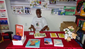 Eric Huntley at the book signing yesterday showing a few of his books.