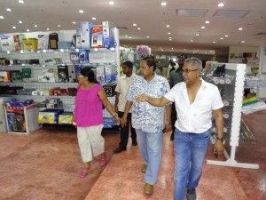 Giftland President, Roy Beepat (right) shows off the Mall’s department store to the Prime Minister and his wife