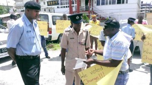 Bus driver, Mark Hopkinson (right) addressing police officers.