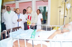 Minister of Public Health, Dr. George Norton interacting  with doctors at the Suddie Hospital.