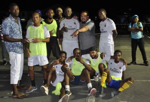 Agricola Captain Kacy John is seen receiving the first prize of $200,000 from Tournament Co-ordinator Colin Belgrave in the presence of teammates Sunday night, at the Pouderoyen Tarmac.