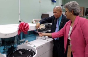 Minister of Public Health Dr. George Norton cuts the ceremonial ribbon on one of the new equipment with the assistance of Balwant Singh’s Hospital Administrator Dr. Madhu Singh