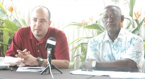 GABF Vice-President (Operations), Michael Singh (left) updates the media yesterday afternoon at the Duke Lodge in the company of IGG Basketball Team Manager, Cecil Chin.