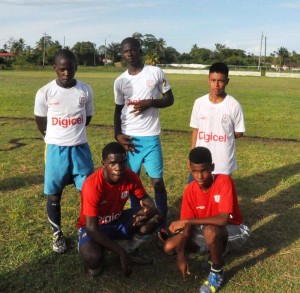 Goal scorers (standing from left) NOC’s Stephon Apple, Kayron Richmond & Jason Perreira (in front for ETI) Nicholas Gillette & Rapheal Cooke. They scored 6 goals between them as the game was tied 3-3 at full time.