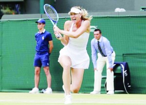 Maria Sharapova of Russia hits a shot during her match against Zarina Diyas of Kazakhstan at the Wimbledon Tennis Championships in London Monday. (Reuters/Suzanne Plunkett)