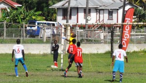 Shaquil Cummins climbs high to skillfully tip a free kick from Nicholas Gillette over the bar.