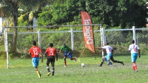 Stephon Apple (number 10 in white shirt) is watched by a couple of ETI defenders as he out sprints another ETI defense player to beat Shamar Lovell in the 3rd minute to open the scoring for NOC 