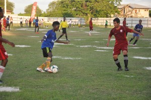 Dawit Watts attempts to get past Bush Lot’s Jeremiah Pereira