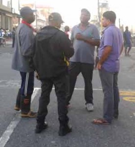 Fire Chief Marlon Gentle (in cap at centre) at the scene 