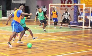 Sparta Boss Denis Edwards attempts to dribble past a defender from Globe Yard in their encounter which the former won.